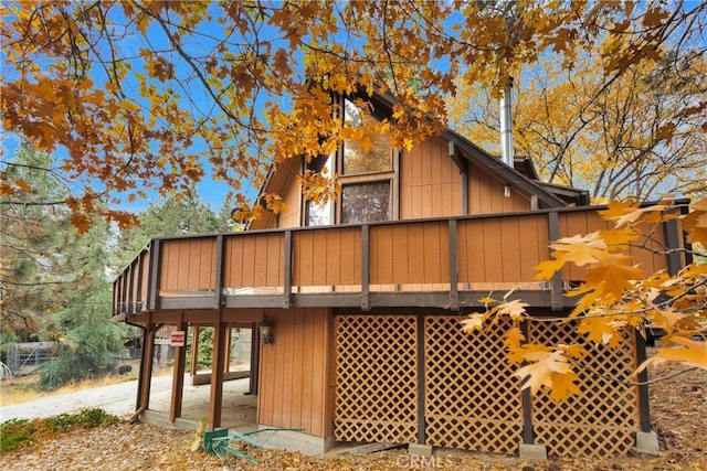 view of side of home featuring a deck