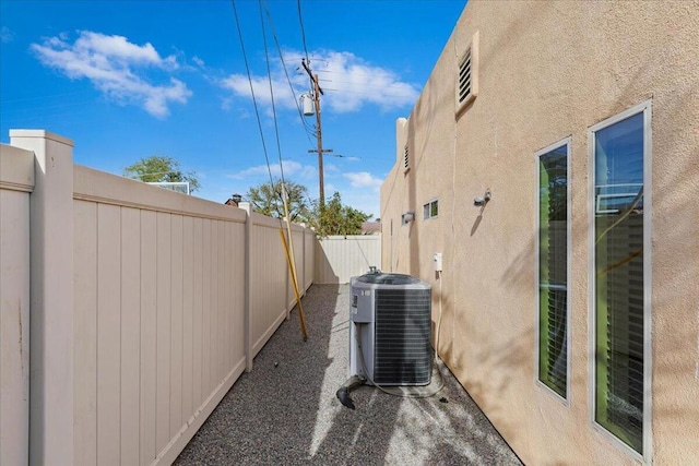 view of side of home featuring central AC unit