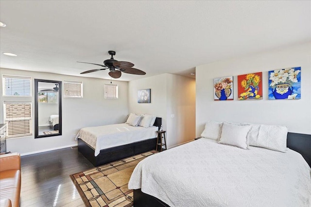 bedroom featuring ceiling fan and dark wood-type flooring