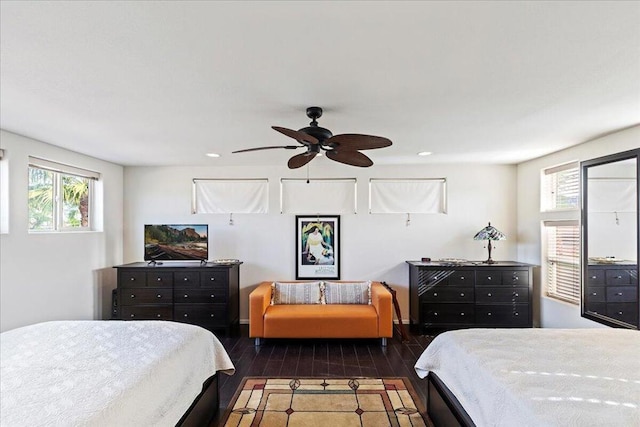 bedroom featuring ceiling fan and dark hardwood / wood-style flooring