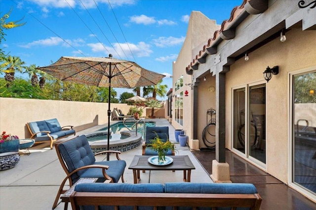 view of patio featuring a swimming pool with hot tub and an outdoor hangout area