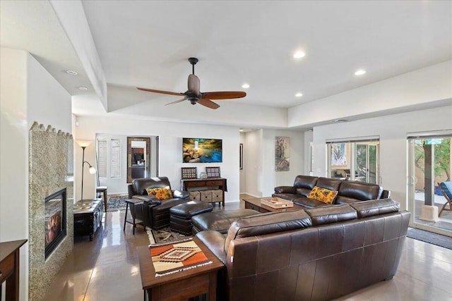 living room with ceiling fan and concrete floors