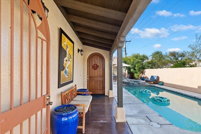 view of pool featuring a patio