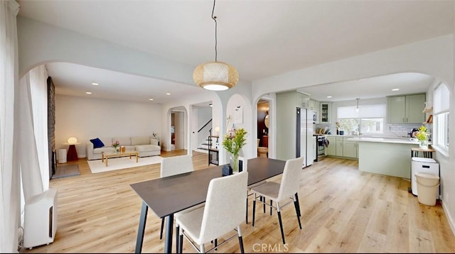 dining area featuring light wood-type flooring