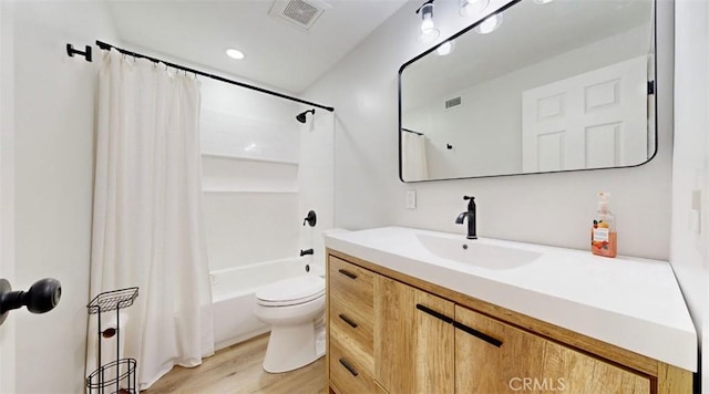 full bathroom featuring shower / bathtub combination with curtain, vanity, toilet, and wood-type flooring