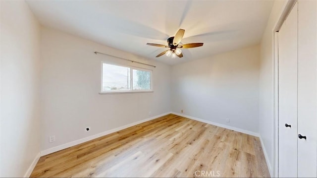 unfurnished bedroom with light hardwood / wood-style floors, ceiling fan, and lofted ceiling