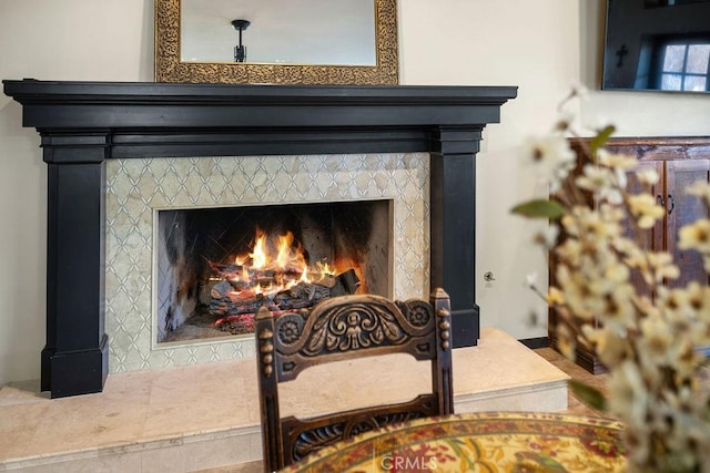 details with a tile fireplace