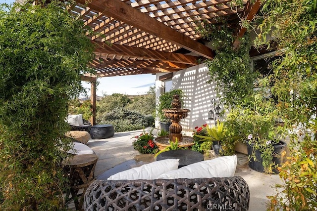 view of patio / terrace featuring an outdoor hangout area and a pergola