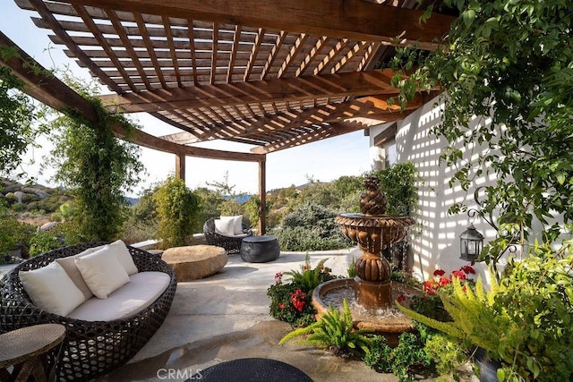 view of patio / terrace featuring an outdoor living space and a pergola