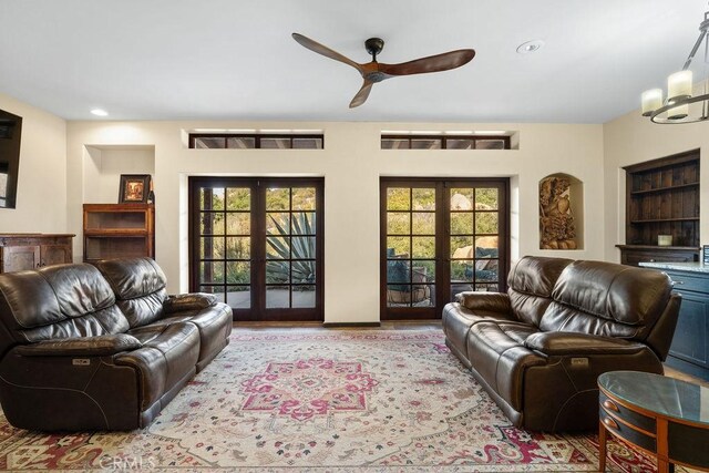 living room with ceiling fan and french doors