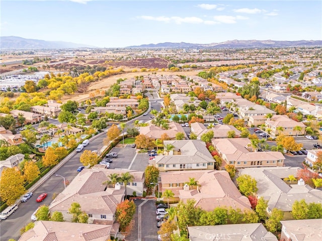 birds eye view of property with a mountain view