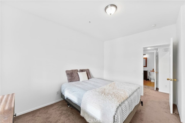 bedroom featuring light colored carpet