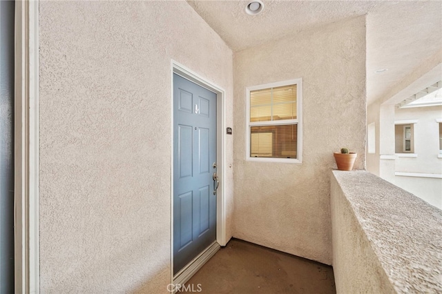 entrance to property with a balcony