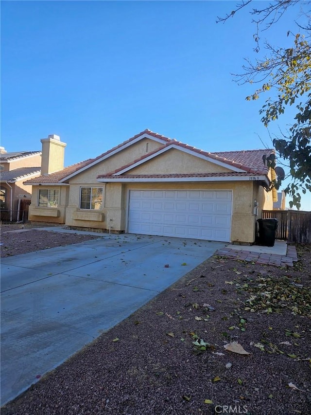 single story home with a garage