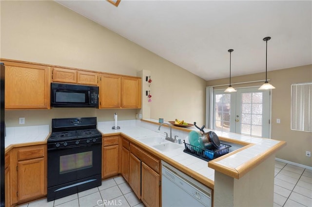 kitchen featuring black appliances, kitchen peninsula, and french doors