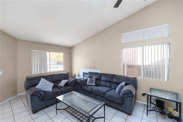 living room with ceiling fan, radiator heating unit, light tile patterned floors, and vaulted ceiling