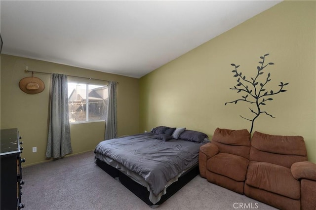 carpeted bedroom with vaulted ceiling