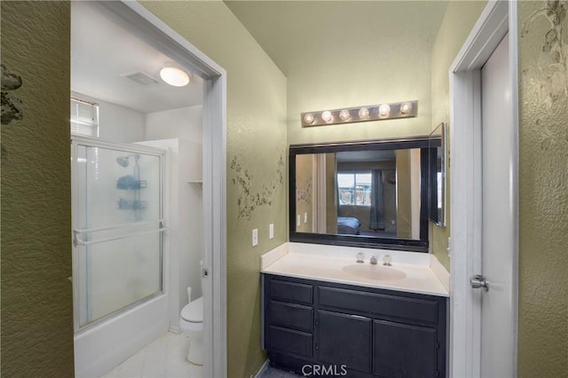 full bathroom with shower / bath combination with glass door, vanity, and toilet