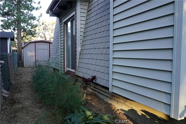 view of home's exterior featuring a storage unit