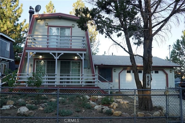 view of front of house with a garage, covered porch, and a balcony