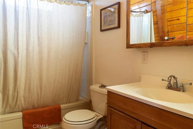 full bathroom with vanity, toilet, shower / bathtub combination with curtain, and plenty of natural light