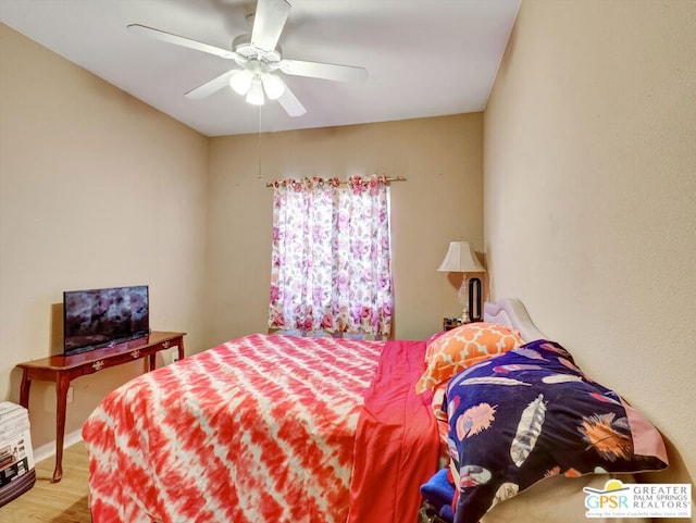 bedroom with hardwood / wood-style flooring and ceiling fan