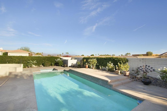 view of swimming pool featuring a patio