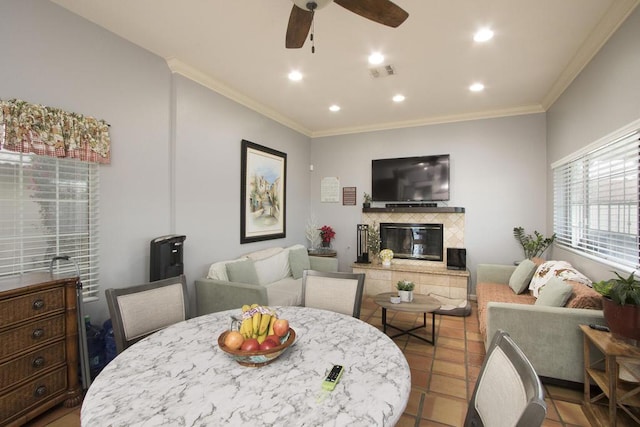 dining space featuring ceiling fan and ornamental molding