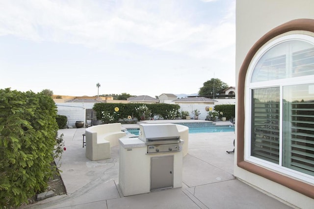 view of patio with exterior kitchen and grilling area