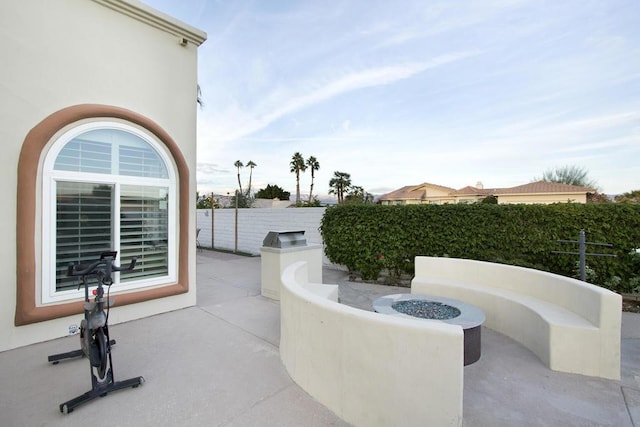 view of patio / terrace with an outdoor fire pit