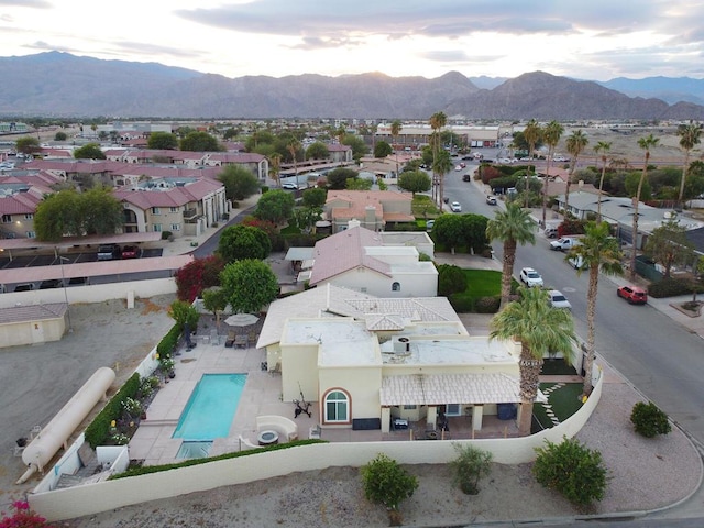 birds eye view of property with a mountain view