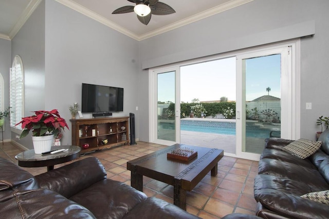 tiled living room featuring ornamental molding and ceiling fan