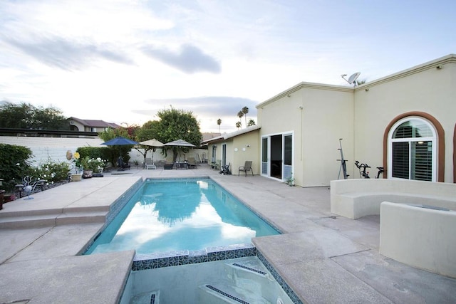 view of swimming pool with a patio area