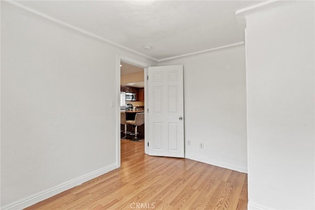 spare room featuring light wood-type flooring