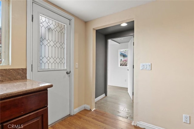 doorway featuring light hardwood / wood-style floors