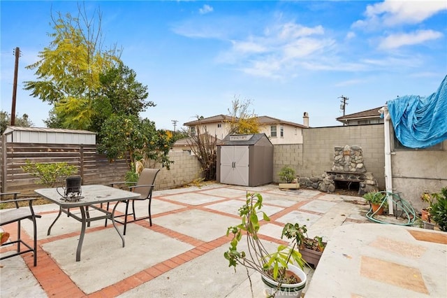 view of patio with a storage shed