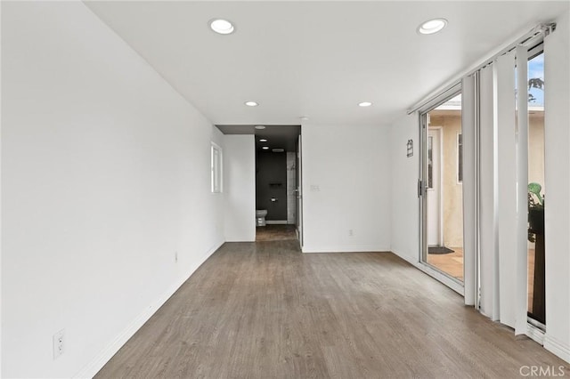 spare room featuring hardwood / wood-style flooring