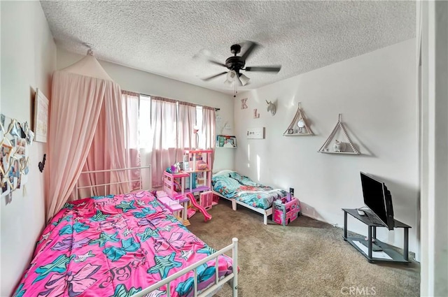 bedroom featuring carpet flooring, ceiling fan, and a textured ceiling