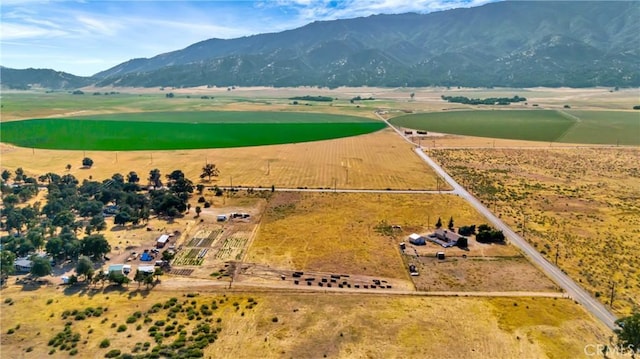 drone / aerial view with a mountain view and a rural view