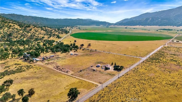 drone / aerial view featuring a mountain view and a rural view