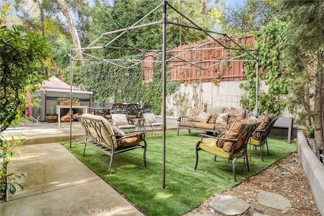 view of patio featuring a gazebo and an outdoor living space