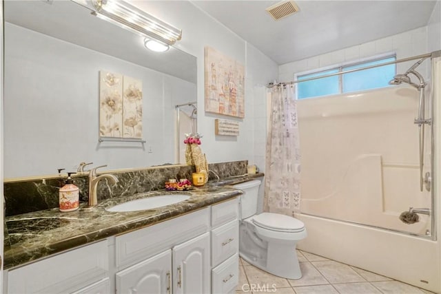 full bathroom featuring tile patterned floors, vanity, shower / bath combo, and toilet