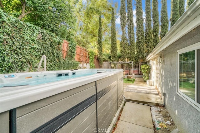 view of patio / terrace featuring a hot tub