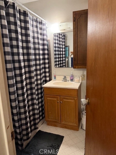 bathroom with vanity and tile patterned floors