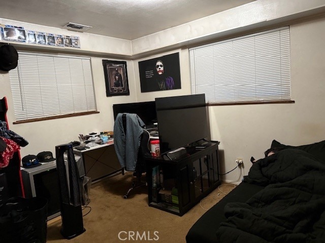 bedroom with carpet and visible vents