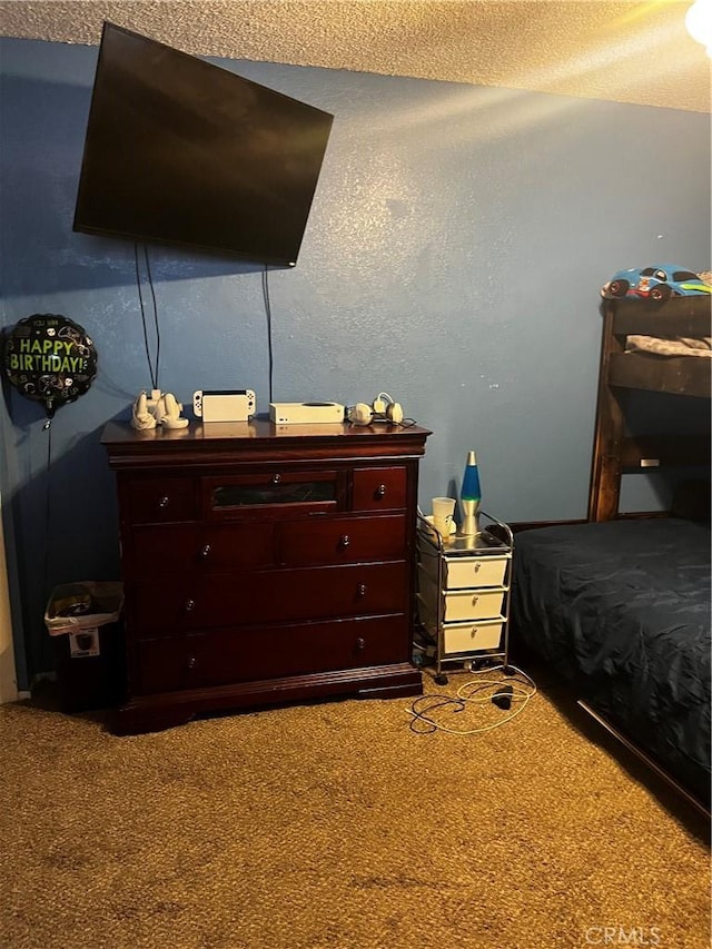 carpeted bedroom with a textured ceiling