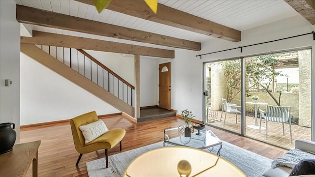 living room featuring wood ceiling, hardwood / wood-style flooring, and beamed ceiling