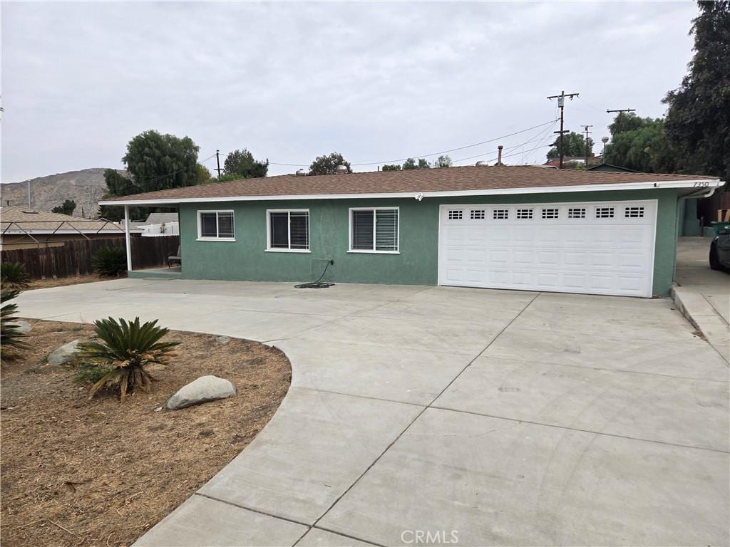 single story home featuring a garage