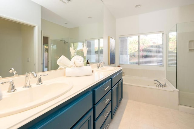 bathroom featuring tile patterned floors, vanity, and independent shower and bath