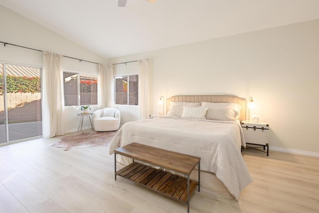 bedroom featuring light wood-type flooring, access to outside, vaulted ceiling, and ceiling fan